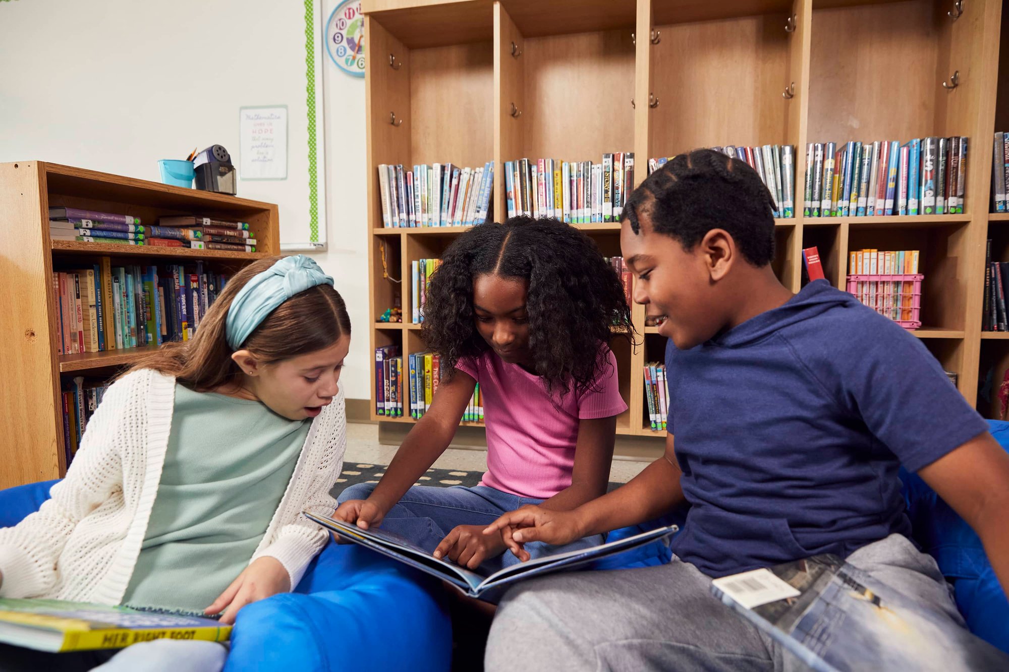 A&L Students in bean bag chairs reading 3 students read 6 A&L Students in bean bag chairs reading 3 students read 6