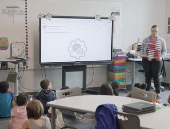 An image of a teacher using a rekenrek to showcase a Eureka Math Squared lesson. 