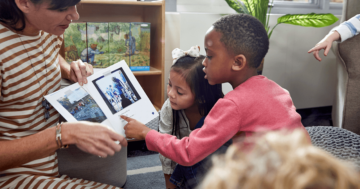 Educator reading a Geodes book to students